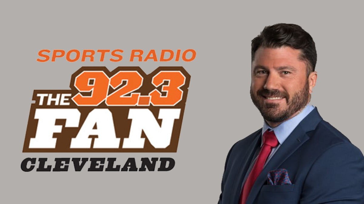 A photo of the 92.3 The Fan logo and Dustin Fox