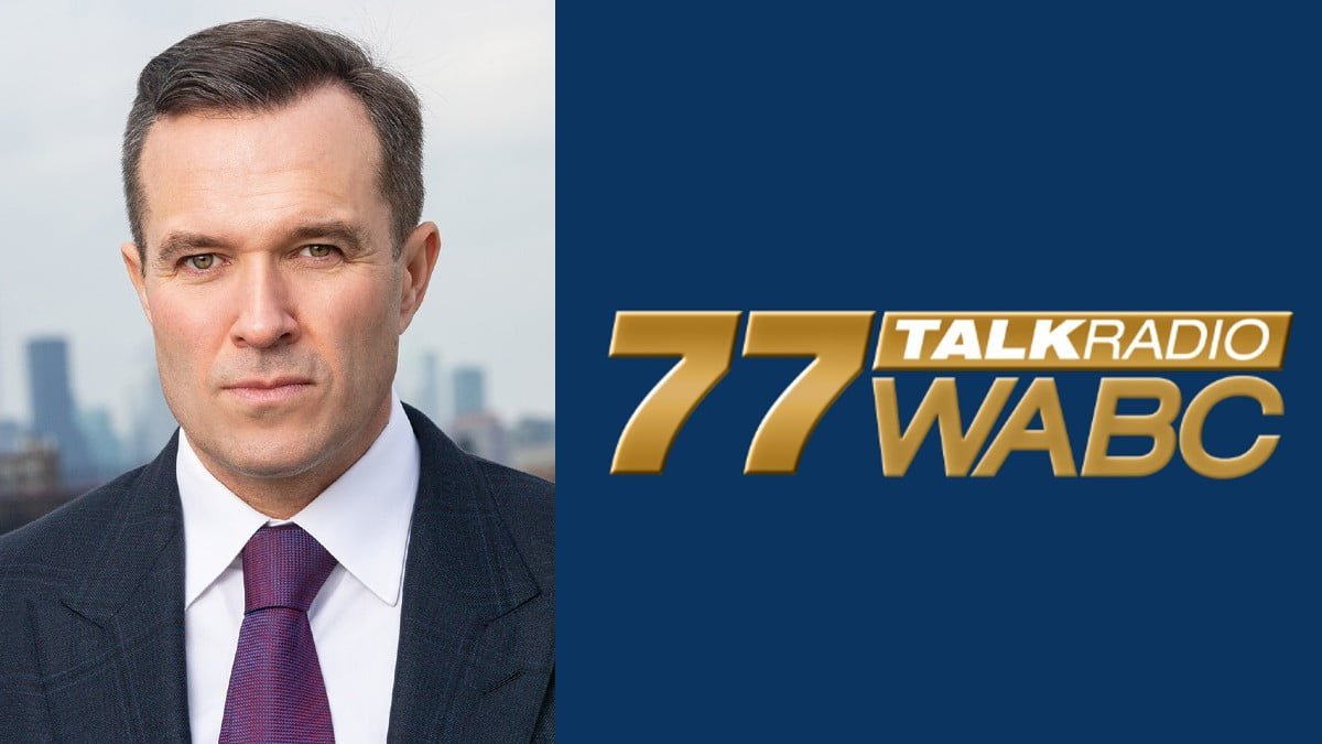 A photo of Greg Kelly and the 77 WABC logo