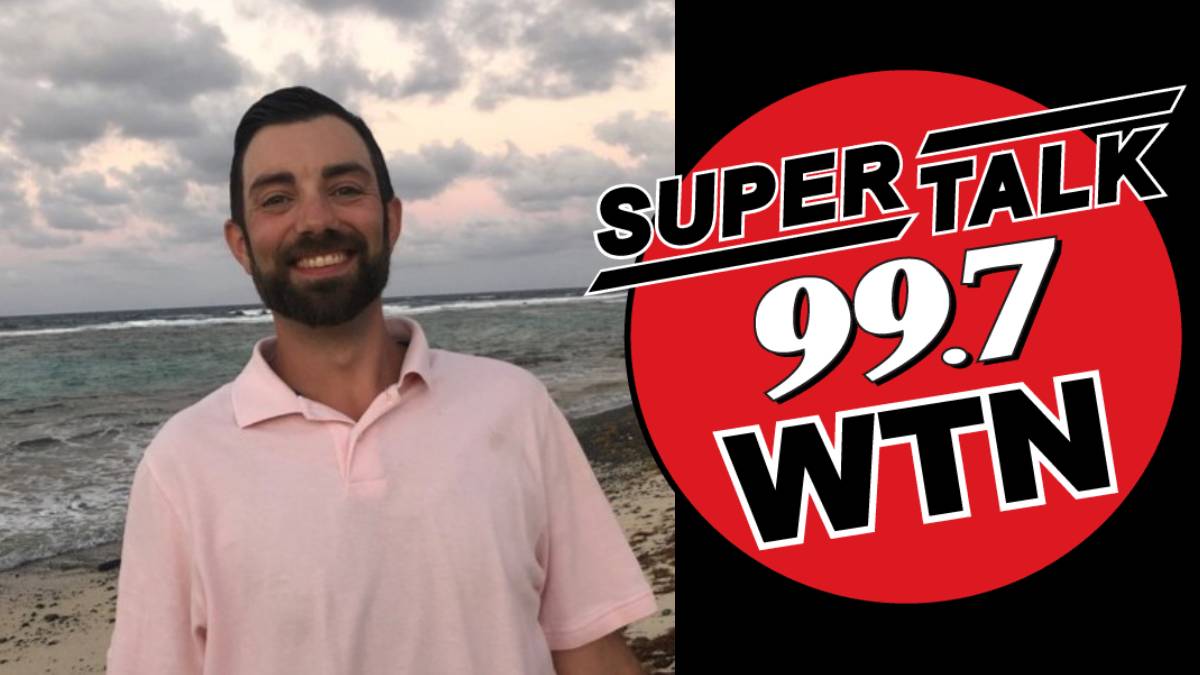 A photo of Chris Hand and the SuperTalk 99.7 WTN logo