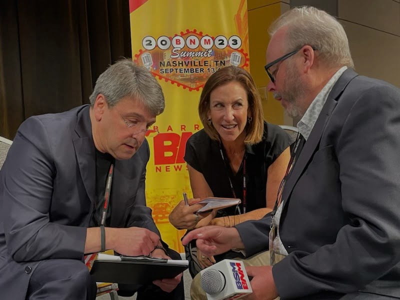 A photo of Direct Results Founder/CEO Jill Albert conferring with Andy Bloom and Peter Thiele