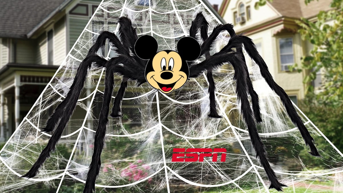 Giant Mickey Mouse spider traps ESPN logo in its web.