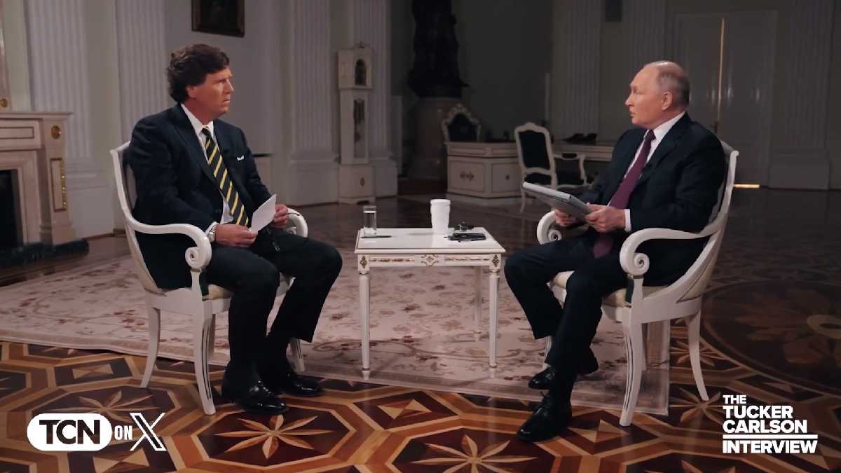 A photo of Tucker Carlson interviewing Vladimir Putin