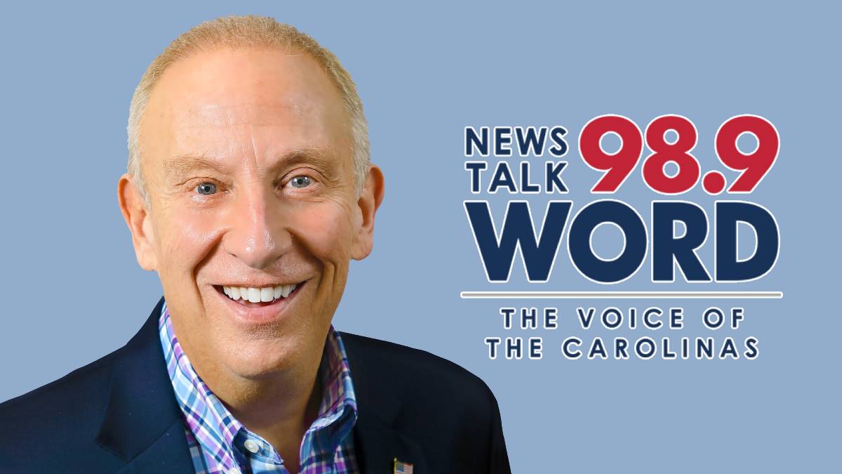 A photo of Mike Gallagher and the 98.9 WORD logo