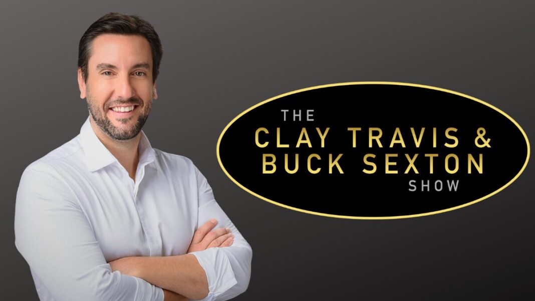 A photo of Clay Travis and his show logo