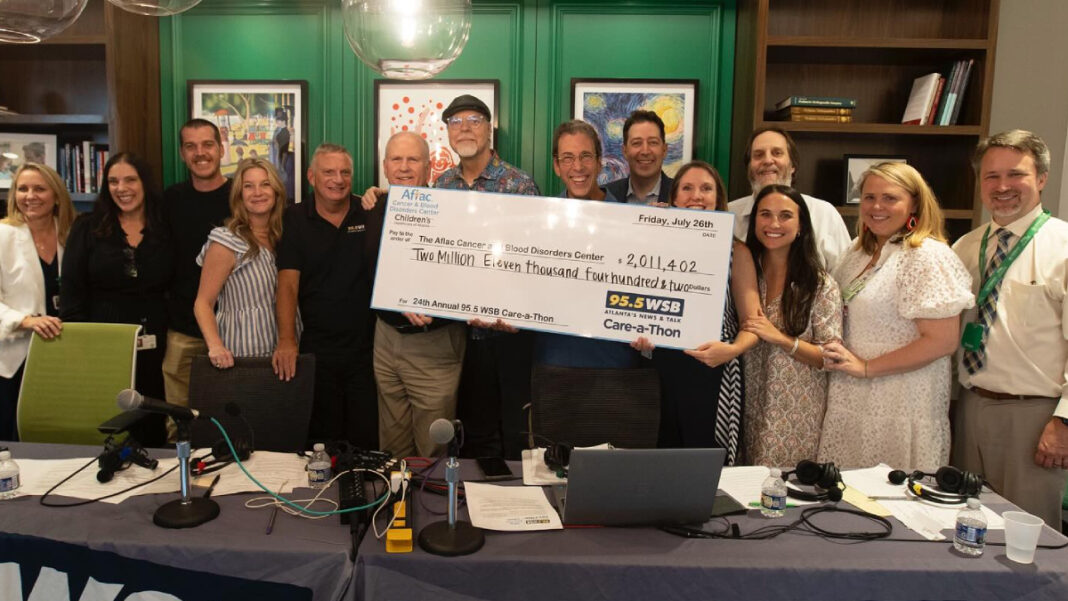 A photo of 95.5 WSB personnel after a radiothon