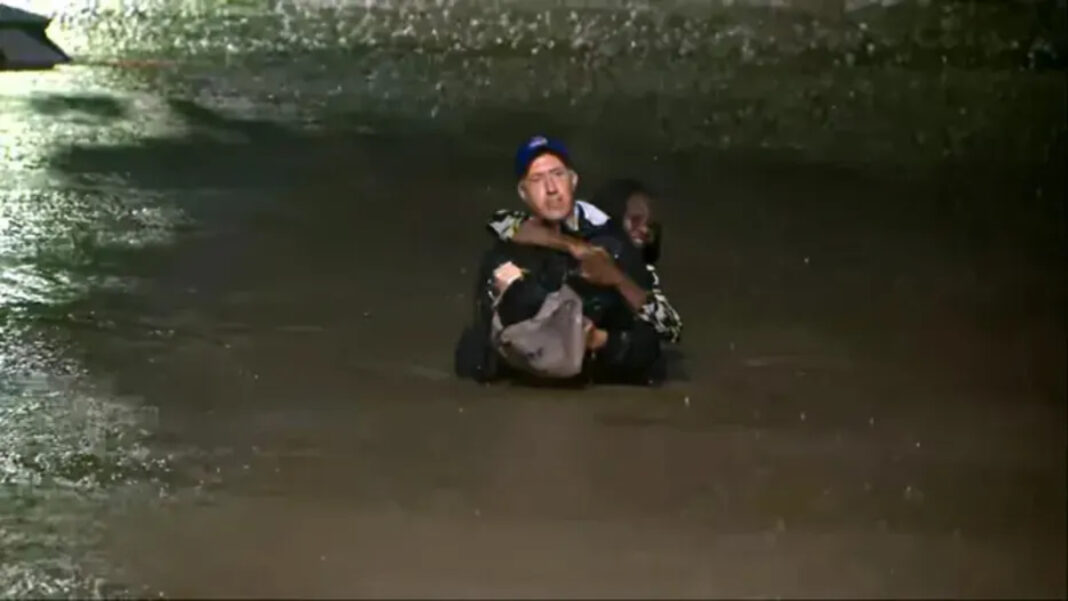 A photo of Bob Van Dillen saving an Atlanta woman