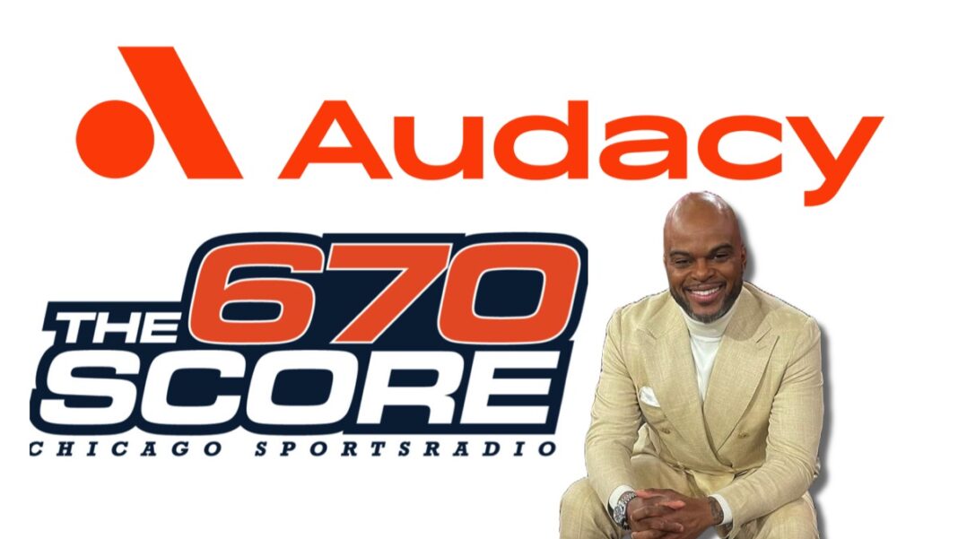 Jason Goff in front of Audacy logos