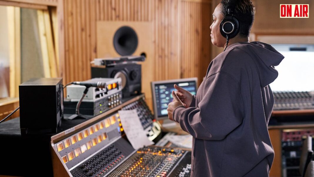 Photo showing a radio producer working in a studio