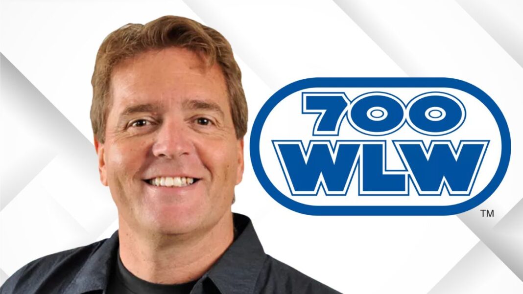 A photo of Mike McConnell and the 700 WLW logo