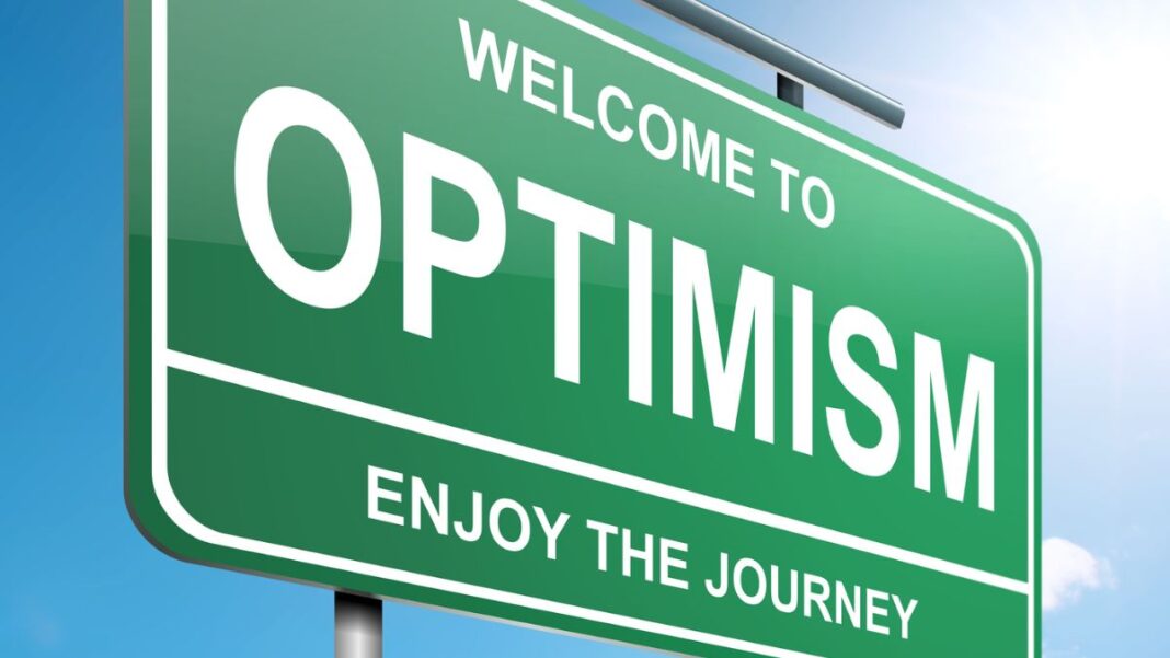 Graphic showing a street sign with Optimism on it