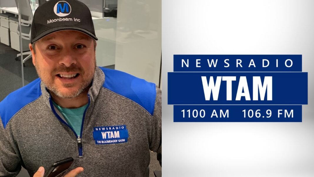 A photo of Bloomdaddy and the WTAM logo