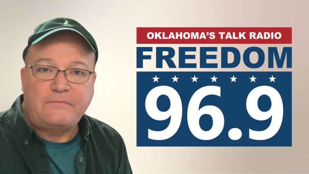 A photo of Lee Matthews and the Freedom 96.9 logo